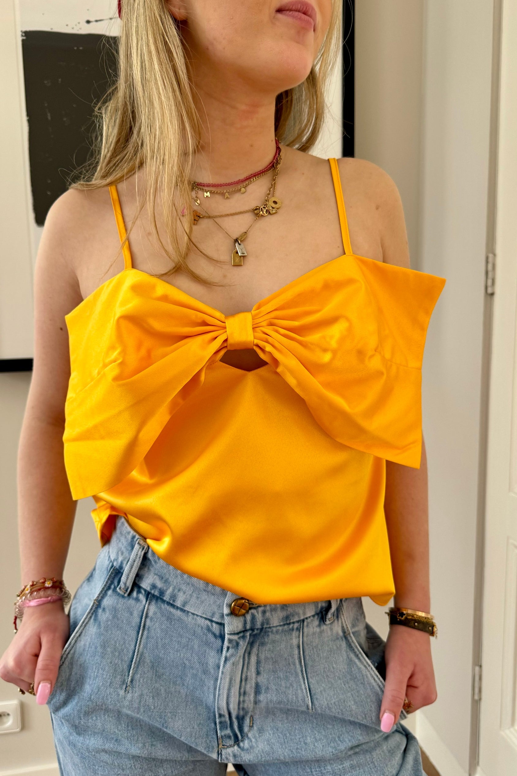 Oranje top met strik